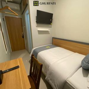Postel nebo postele na pokoji v ubytování Ghurfati Hotel Wedana
