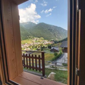 a window with a view of a town and mountains at Al Doss in Rabbi