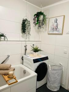 a kitchen with a microwave and a sink at Rosengarten Apartments in Tettnang in Tettnang