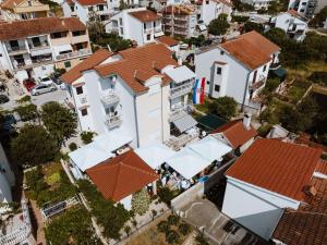 an overhead view of a white house with orange roofs at Apartments Šime in Šibenik