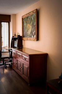 a room with a desk with a computer on top of it at Suites Cuija Coyoacan in Mexico City