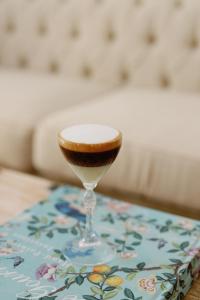 a wine glass sitting on top of a table at Palácio do Visconde - The Coffee Experience in Lisbon