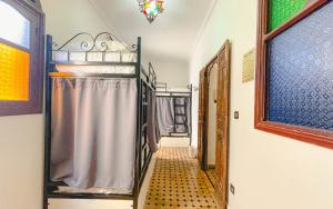 A bed or beds in a room at Tangier Kasbah Hostel