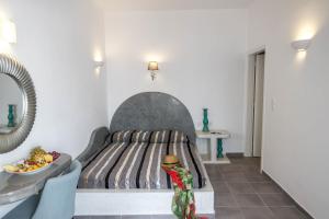 Postel nebo postele na pokoji v ubytování Remvi Suites