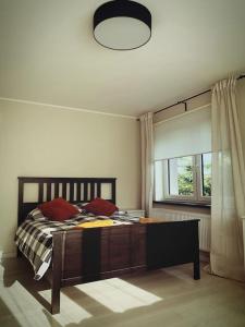 Llit o llits en una habitació de Apartament Słoneczny Świerkowa