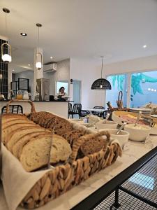 a table with bread on top of it in a kitchen at HotelN26 in Mar del Plata