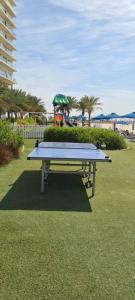 a ping pong table in a park with a playground at A Perfect Escape - Sea facing in Ras al Khaimah