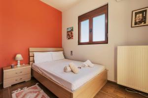 Postel nebo postele na pokoji v ubytování Hillwings Villa