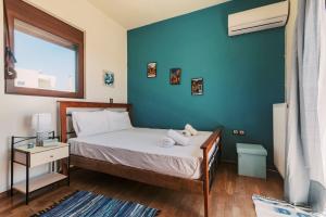 Postel nebo postele na pokoji v ubytování Hillwings Villa