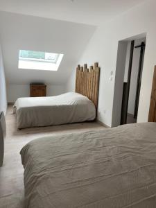 Krevet ili kreveti u jedinici u okviru objekta Appartement a 12 mn de Cauterets