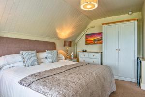 a bedroom with a large white bed in a room at Botany Bay Hotel in Broadstairs
