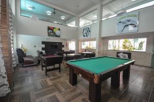 a billiard room with a pool table in it at 182G - Excelente cobertura em condomínio completo in Bombinhas