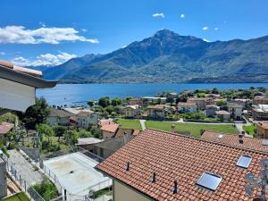 a view of a town with a lake and mountains at Immobillario - Lakes Dream in Domaso