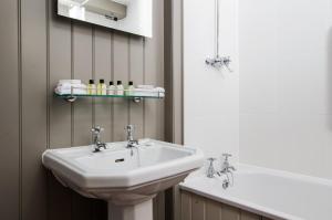 Salle de bains dans l'établissement Botany Bay Hotel