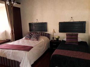 מיטה או מיטות בחדר ב-Casa Antigua