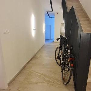 a bike leaning against a wall in a room at Amar 4 in Zemun