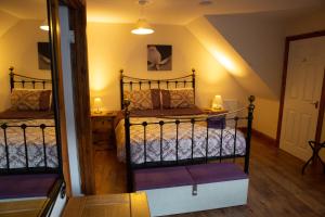 a bedroom with two bunk beds and a mirror at Groveside Holiday Lets in Saltburn-by-the-Sea