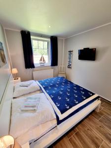 a bedroom with a large bed and a window at Ferienwohnung Bad Doberan in Bad Doberan