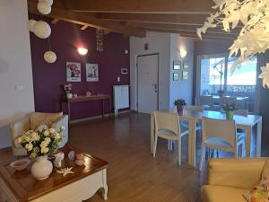 a living room with a table and a dining room at B&B Carlotta in Montesilvano