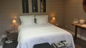 Ein Bett oder Betten in einem Zimmer der Unterkunft B&B De Tuinkamer