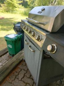 a stove top oven with a grill on top of it at Glamping on the Green River in Washago