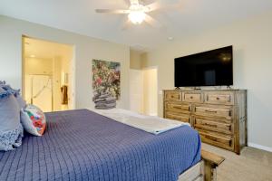 a bedroom with a bed and a flat screen tv at Resort Amenities and Patio at 55 and Goodyear Escape! in Goodyear +24 photos