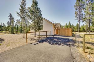 a house with a gate and a fence in front at Modern Studio in Bend about 3 Mi to Sunriver Resort! in Bend