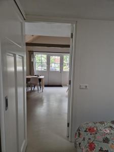 a view of a living room with a dining room at Fenix Edam in Edam