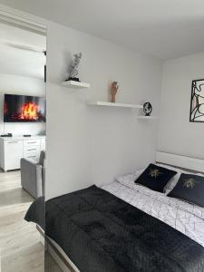 Posteľ alebo postele v izbe v ubytovaní Charming Apartament