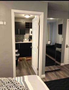 a room with a bed and a kitchen with a bathroom at Studio Gaslamp Conv Cntr - W Parking & 2 Beds #4 in San Diego