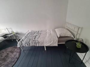 Postel nebo postele na pokoji v ubytování Duplex dans le centre d'Heusy