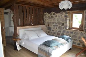 A bed or beds in a room at Casa Maru