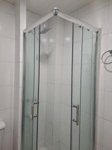 a shower with a glass door in a bathroom at centrico pb "A" in Resistencia +5 photos