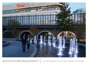 a man and woman walking in front of a fountain at Minet Gardens - Modern Centrally located - Suite 5 in London