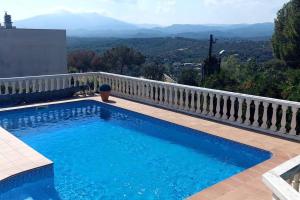 a swimming pool with a view of the mountains at Bravaholidays-600-Mas Altaba in Terra Brava