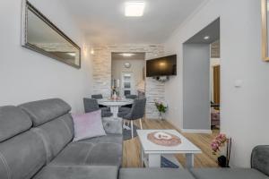 a living room with a couch and a table at Da Da in Kaštela