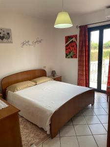 Postel nebo postele na pokoji v ubytování Casa Mary, vero relax a 15 min. dal mare-IUN Q1172