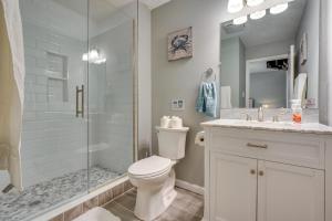 a bathroom with a shower and a toilet and a sink at Outdoor Entertainment Areas Family Ohio Getaway in Howard +20 photos