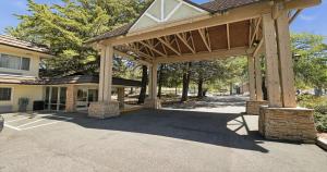 a large wooden pavilion in front of a house at Best Western Gold Country Inn in Grass Valley