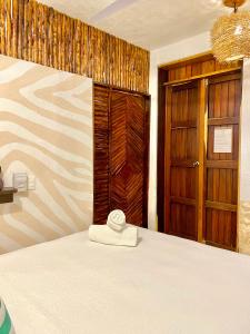 Postel nebo postele na pokoji v ubytování Xcabal Hotel boutique + 37 fotografií