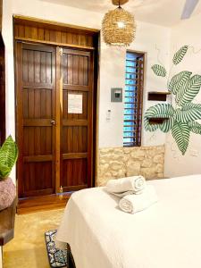 Postel nebo postele na pokoji v ubytování Xcabal Hotel boutique