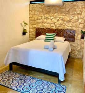 Postel nebo postele na pokoji v ubytování Xcabal Hotel boutique