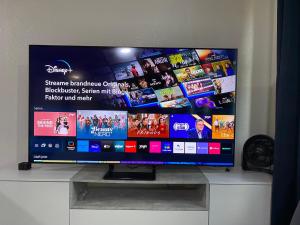 a flat screen tv sitting on top of a cabinet at Kaiserswerth in Düsseldorf