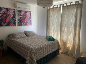 Postel nebo postele na pokoji v ubytování PENTHOUSE EN MONTERRICO