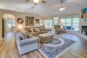 a living room with a couch and a table at Hot Springs Village Home with Golf Course View in Hot Springs Village