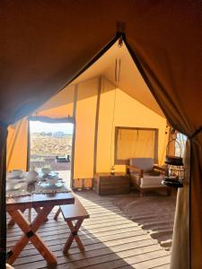 a tent with a table with dishes on it at Double Eagle in Valle