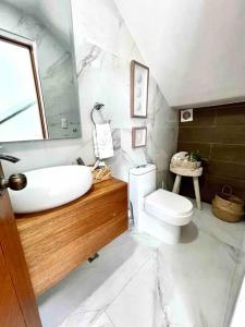 a white bathroom with a sink and a toilet at LUXURY_VIP_Villa_LifeStyle puerto plata in San Felipe de Puerto Plata +45 photos