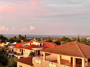 a group of houses with red roofs at LUXURY_VIP_Villa_LifeStyle puerto plata in San Felipe de Puerto Plata