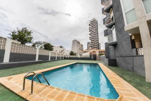 a swimming pool on the side of a building at Hernando II in Calpe