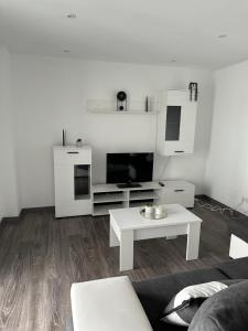 a living room with a couch and a coffee table at Piso Sardinero - Almar d'Pipe in Santander